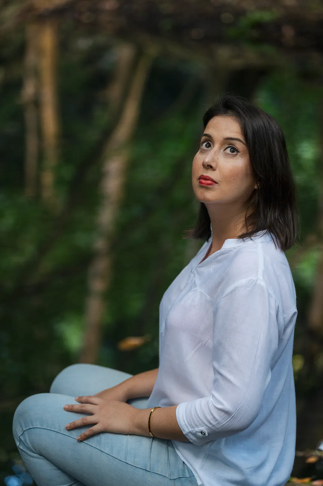 Portrait of Jade Swenson in a green forest